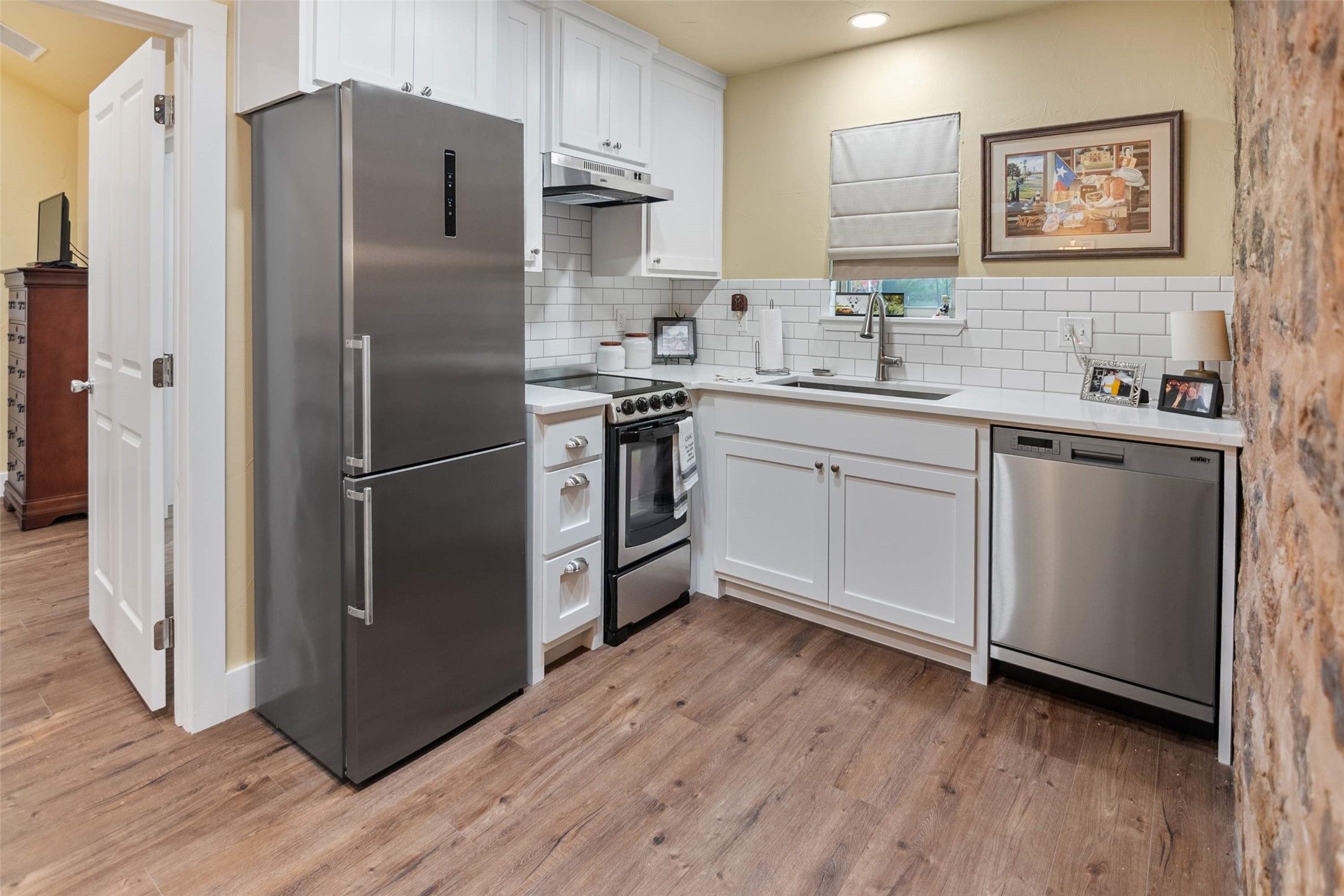 761 Post Hill Street Mason, TX 76856 - Photo 22 of 25 a kitchen with stainless steel appliances a refrigerator sink and microwave
