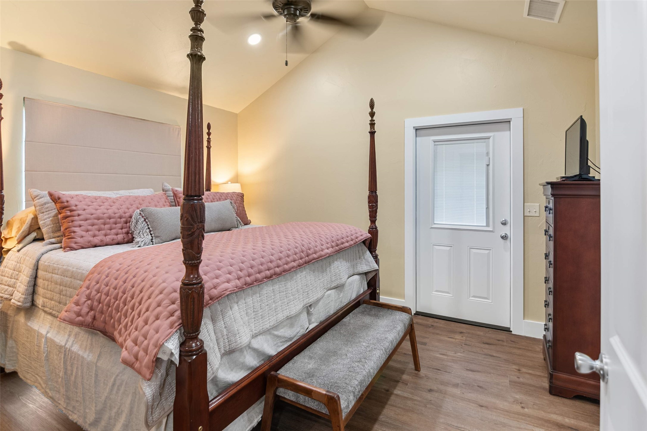 761 Post Hill Street Mason, TX 76856 - Photo 23 of 25 a bedroom with a bed and wooden floor
