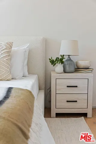 a bedroom with a bed and a dresser