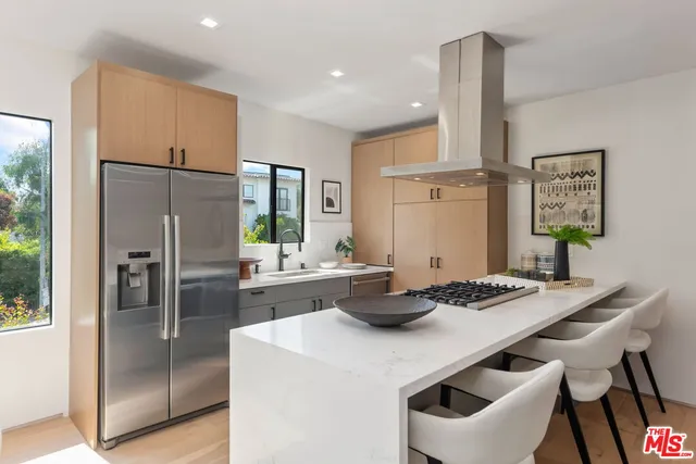 a kitchen with a table and chairs in it