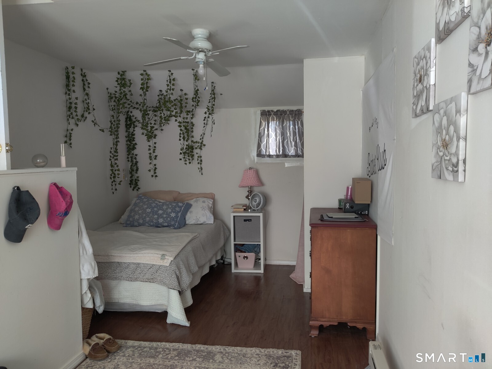 100 Loftus Circle Bridgeport, CT 06606 - Photo 14 of 16 a bedroom with a bed and a chandelier