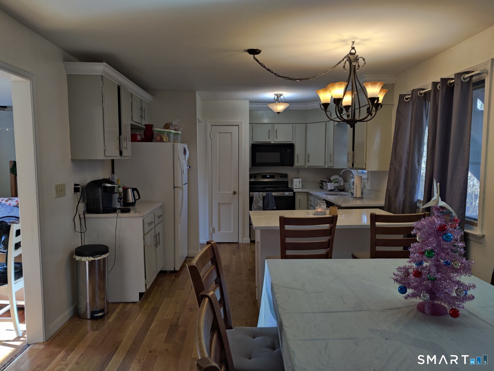 100 Loftus Circle Bridgeport, CT 06606 - Photo 6 of 16 a kitchen with stainless steel appliances kitchen island granite countertop a refrigerator and a stove top oven