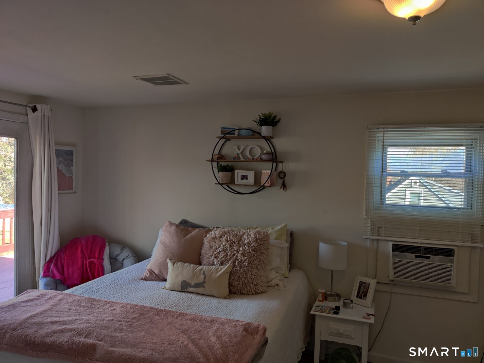 100 Loftus Circle Bridgeport, CT 06606 - Photo 9 of 16 a bedroom with a bed and a tv on table