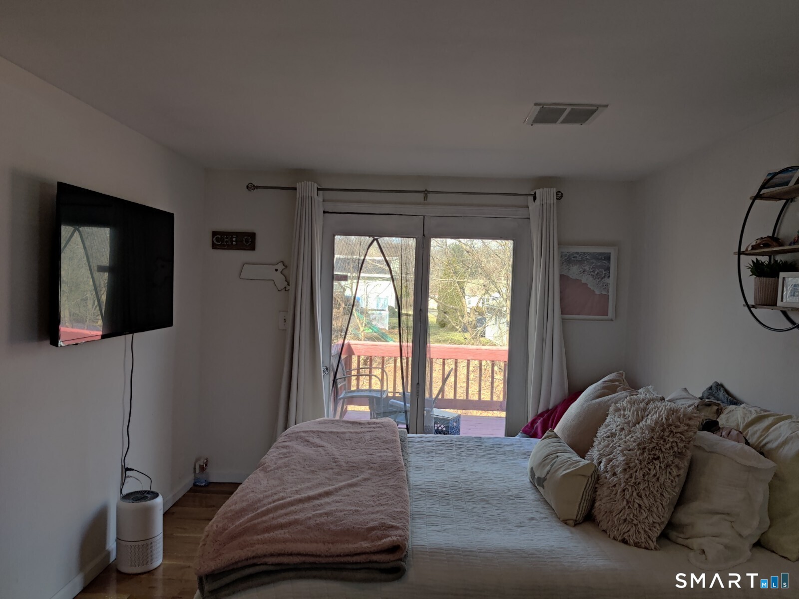 100 Loftus Circle Bridgeport, CT 06606 - Photo 10 of 16 a bed sitting in a bedroom next to a window