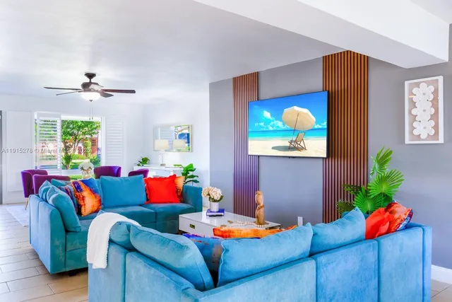 a table room with furniture and a potted plant