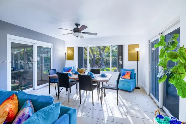 a open kitchen with stainless steel appliances granite countertop a refrigerator and a stove top oven