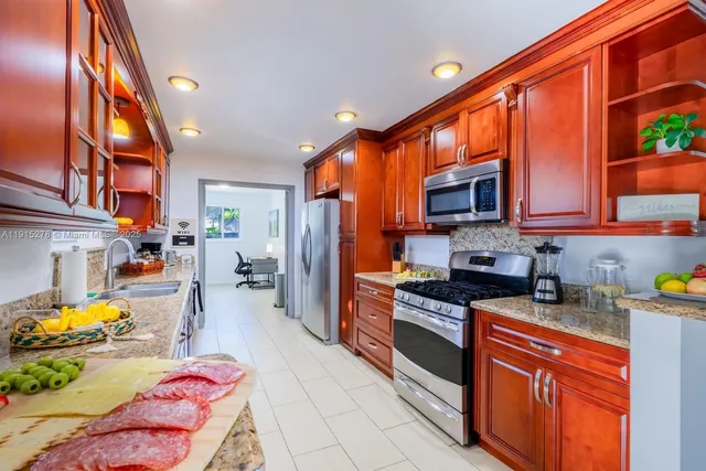 a bedroom with two beds and a large window