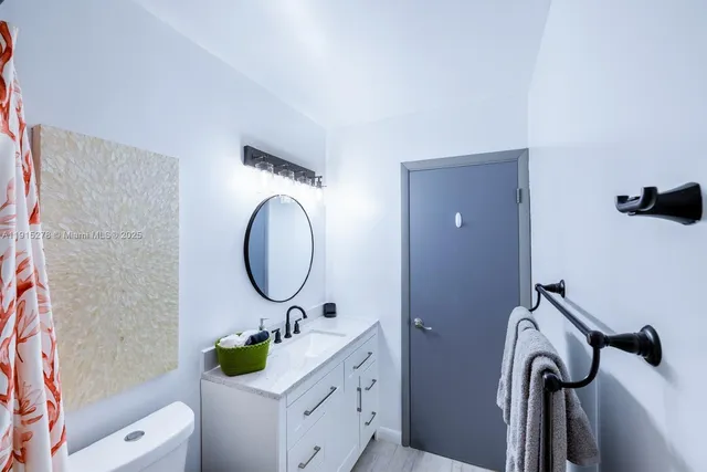 a swimming pool with outdoor seating and garden