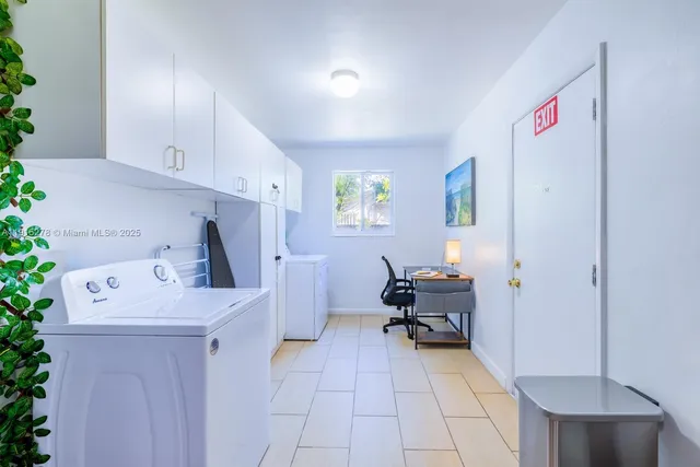 a view of a house with backyard porch and sitting area