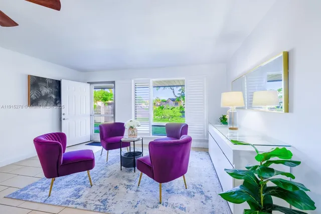 a living room with furniture and a rug