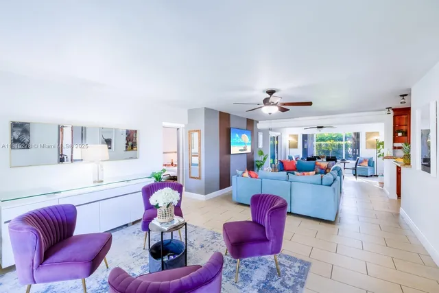 a living room filled with furniture and a rug