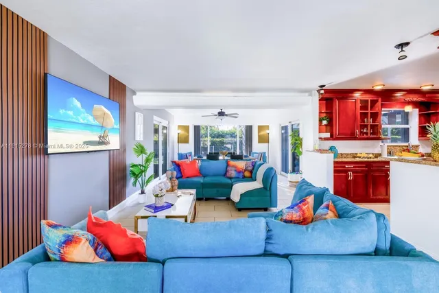 a living room with furniture flowerpot and a potted plant