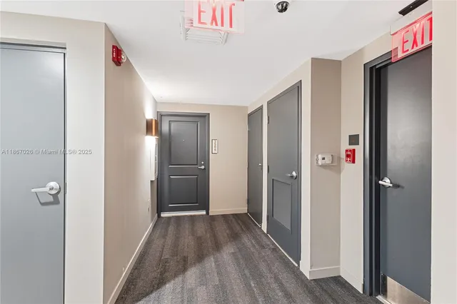 a view of a hallway with washer and dryer