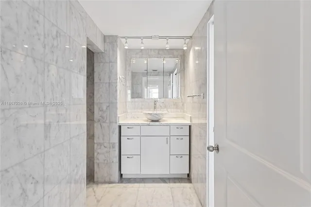 a bath room with a toilet and a bath tub