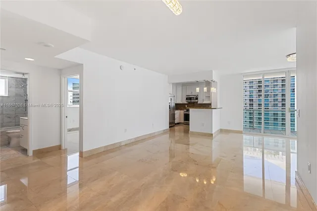 a view of a room that has a large window