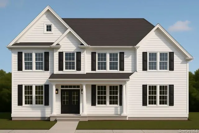 a view of a white house with large windows