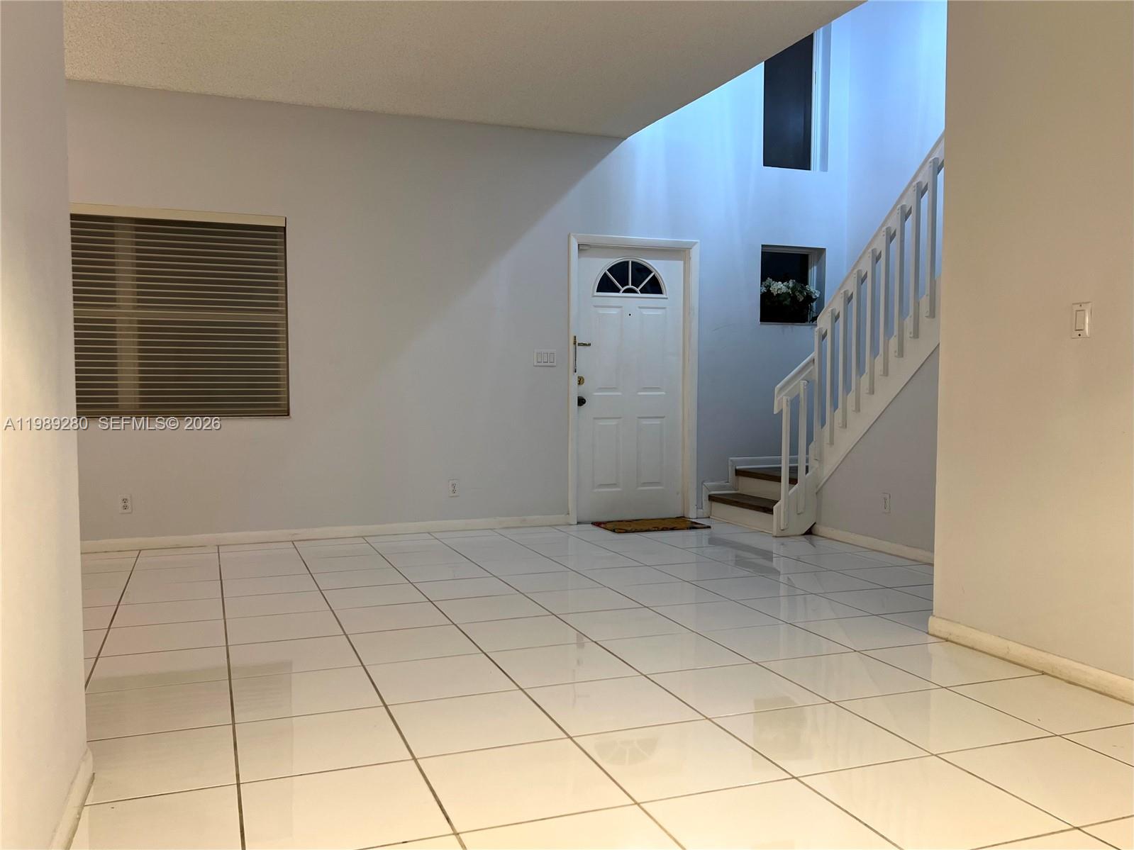 543 Racquet Club Road, Unit 33 Weston, FL 33326 - Photo 3 of 28 a view of an empty room with windows