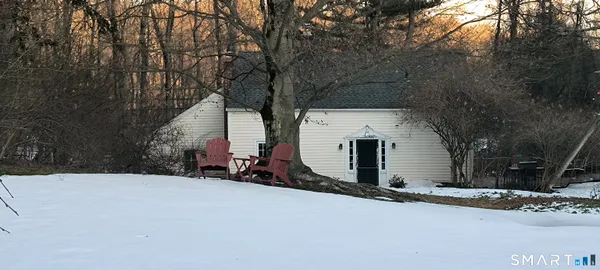 a house with trees in front of it