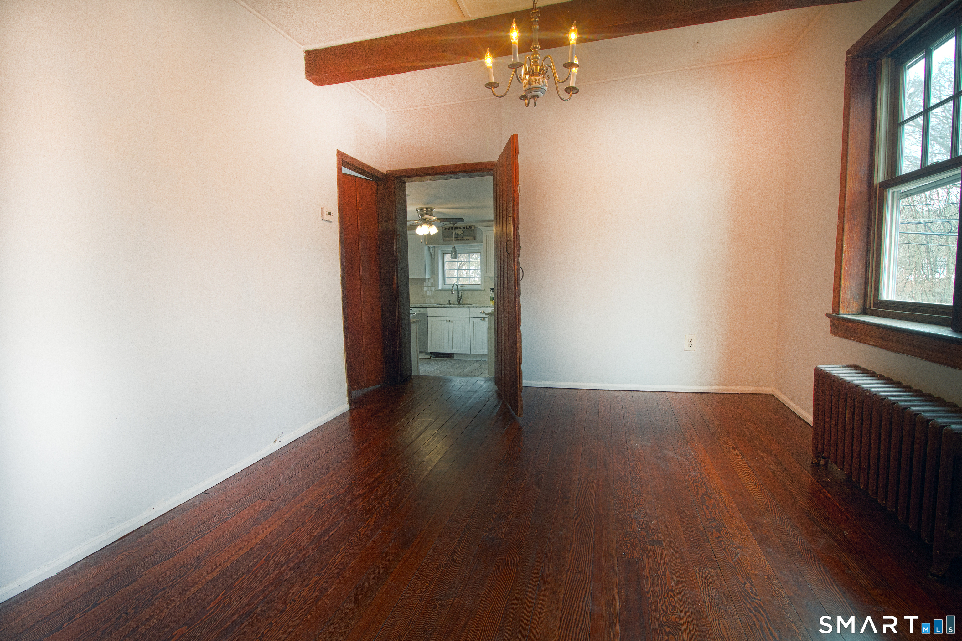 21 B Hoydens Hill Road Fairfield, CT 06824 - Photo 12 of 39 an empty room with wooden floor and windows