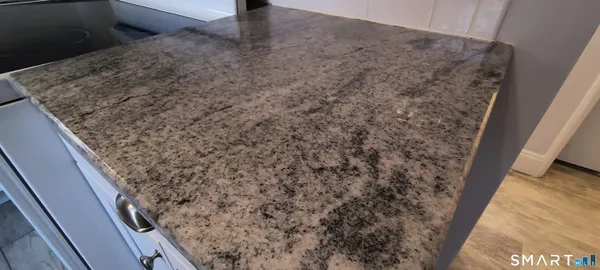 a bathroom with a sink vanity and a mirror