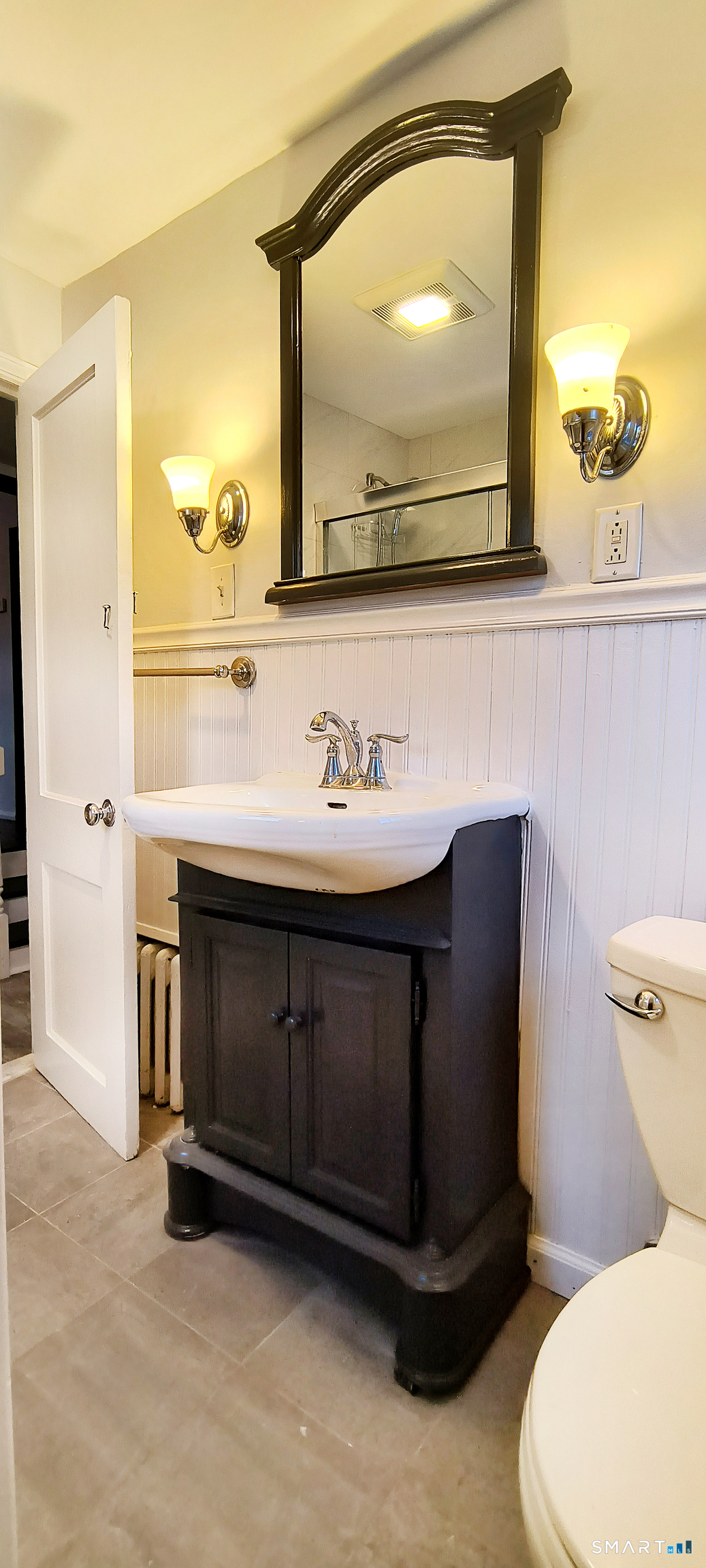 21 B Hoydens Hill Road Fairfield, CT 06824 - Photo 21 of 39 a bathroom with a sink vanity and a mirror