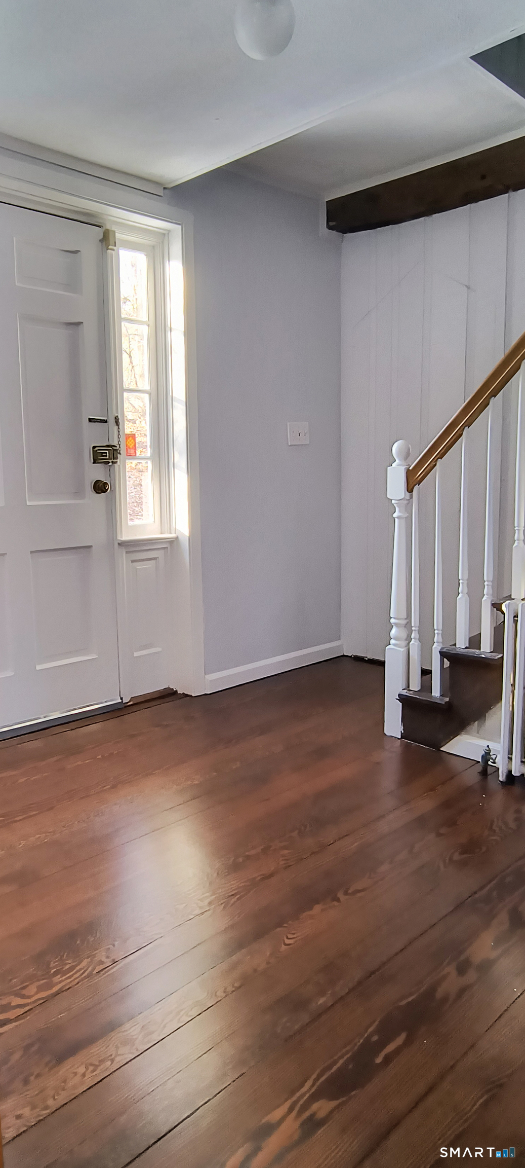 21 B Hoydens Hill Road Fairfield, CT 06824 - Photo 26 of 39 an empty room with wooden floor and windows