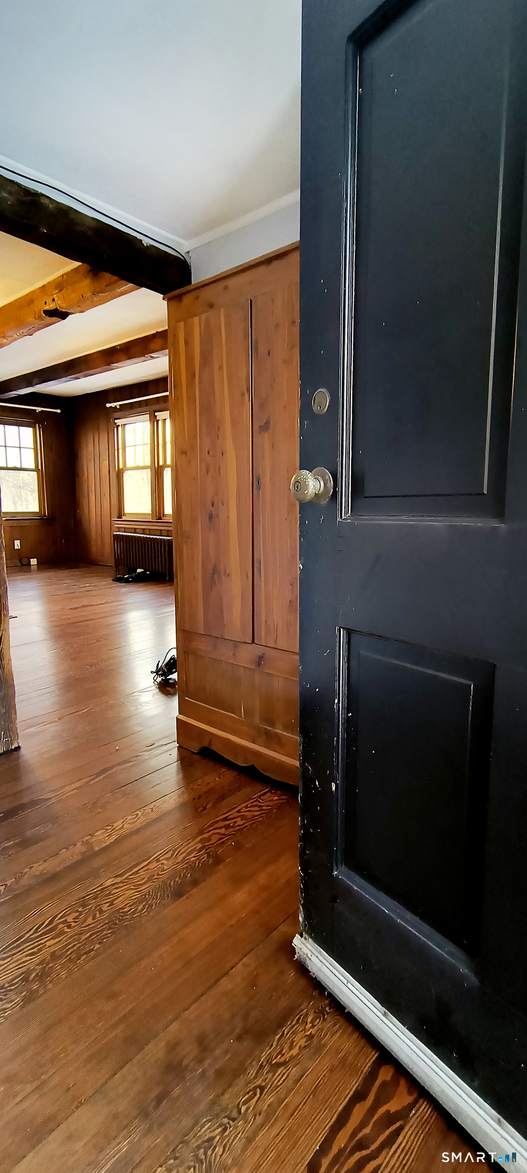 21 B Hoydens Hill Road Fairfield, CT 06824 - Photo 27 of 39 a view of an empty room with wooden floor and a fireplace