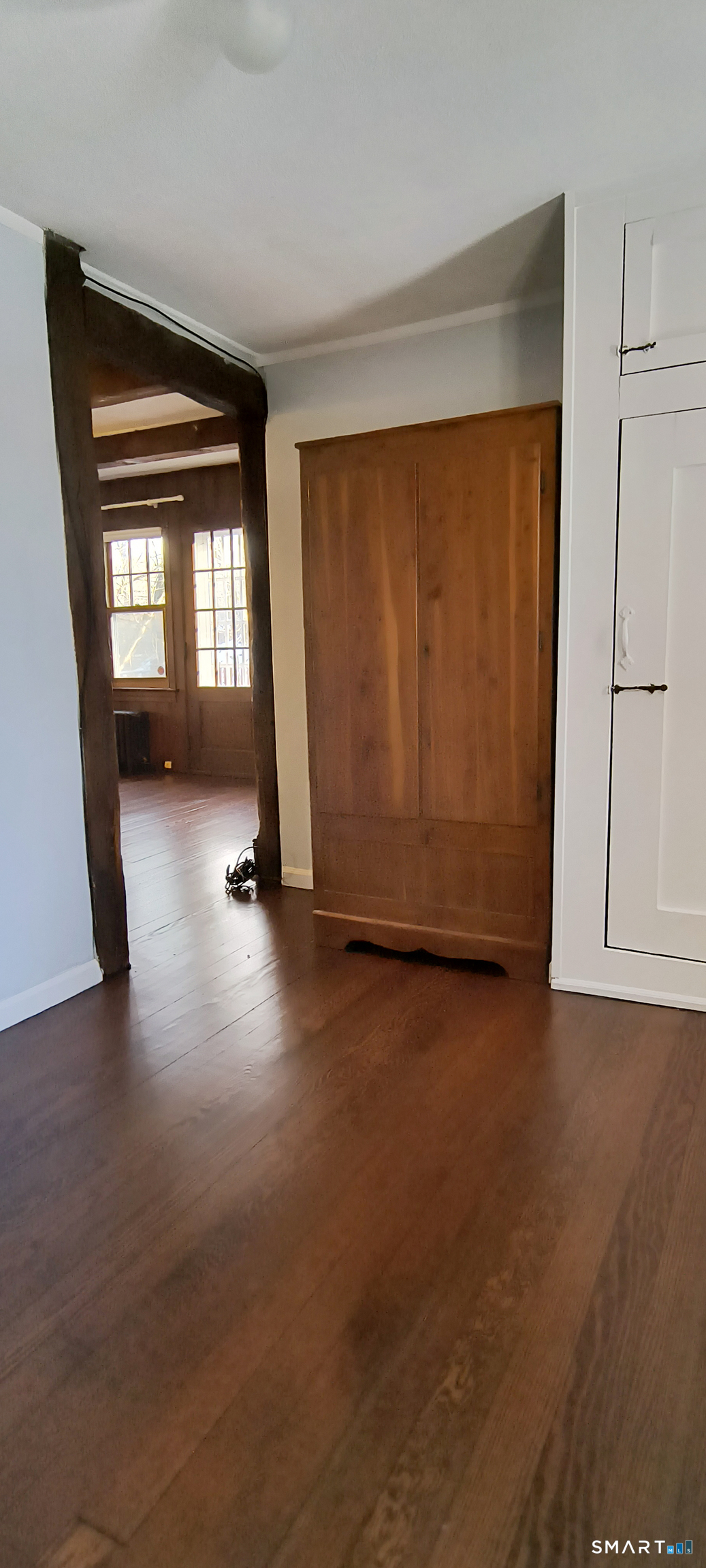 21 B Hoydens Hill Road Fairfield, CT 06824 - Photo 28 of 39 wooden floor in an empty room with a window