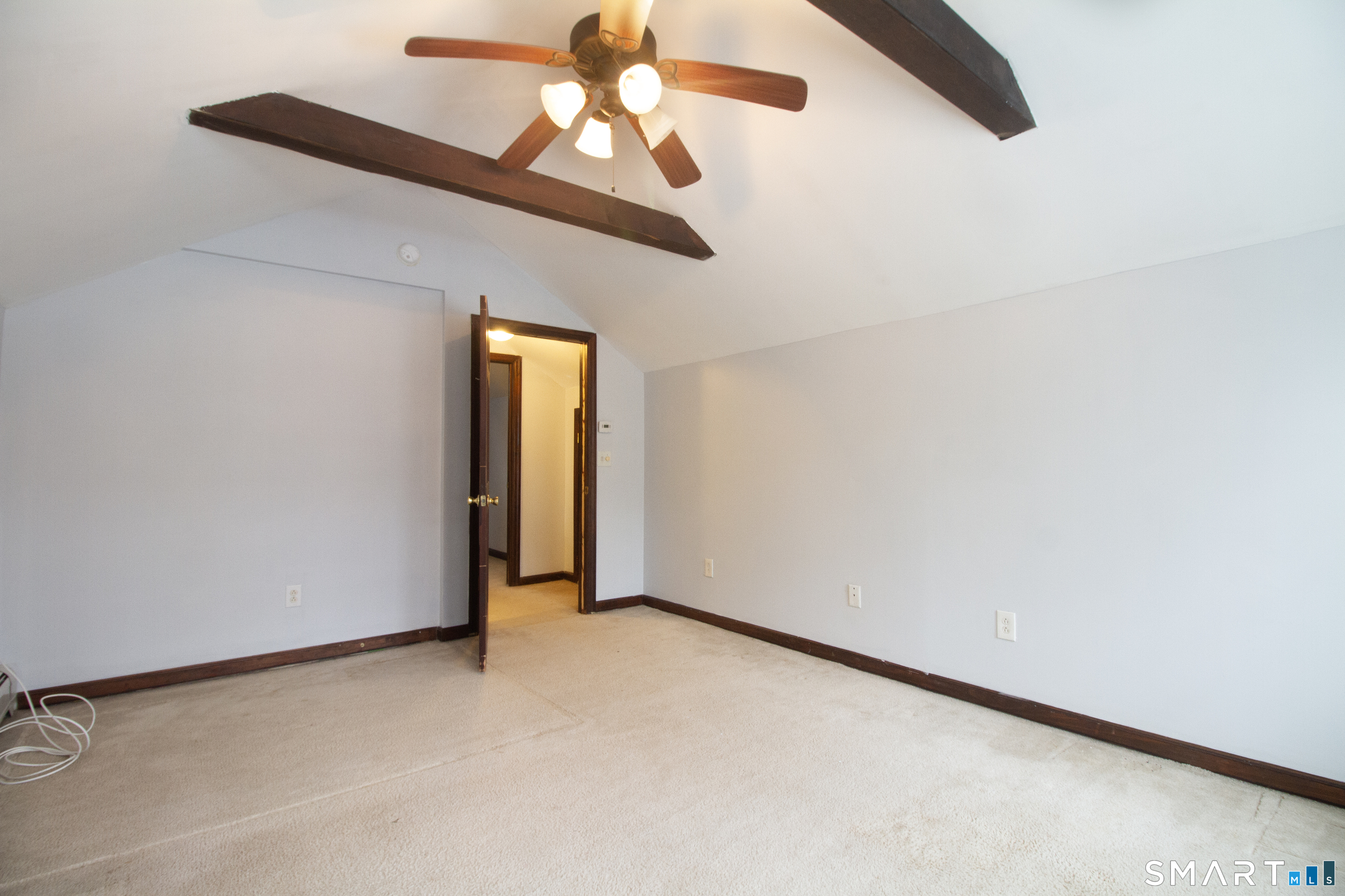 21 B Hoydens Hill Road Fairfield, CT 06824 - Photo 32 of 39 an empty room with a window and a ceiling fan