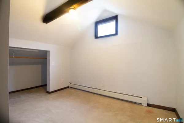 a view of wooden floor and windows in a room