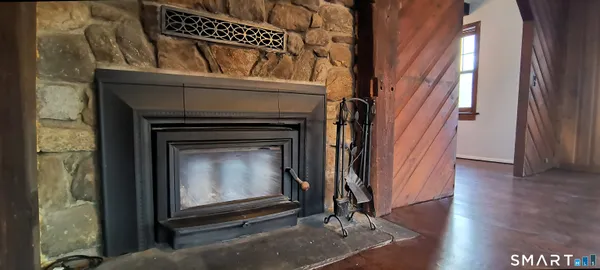 a view of an entryway with fireplace