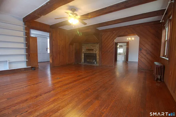 wooden floor in an empty room with a mirror