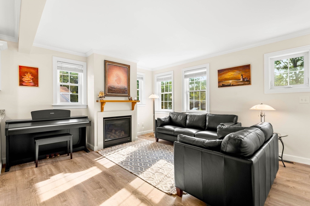 84 Ferry Road Salisbury, MA 01952 - Photo 13 of 42 a living room with furniture a fireplace and a window