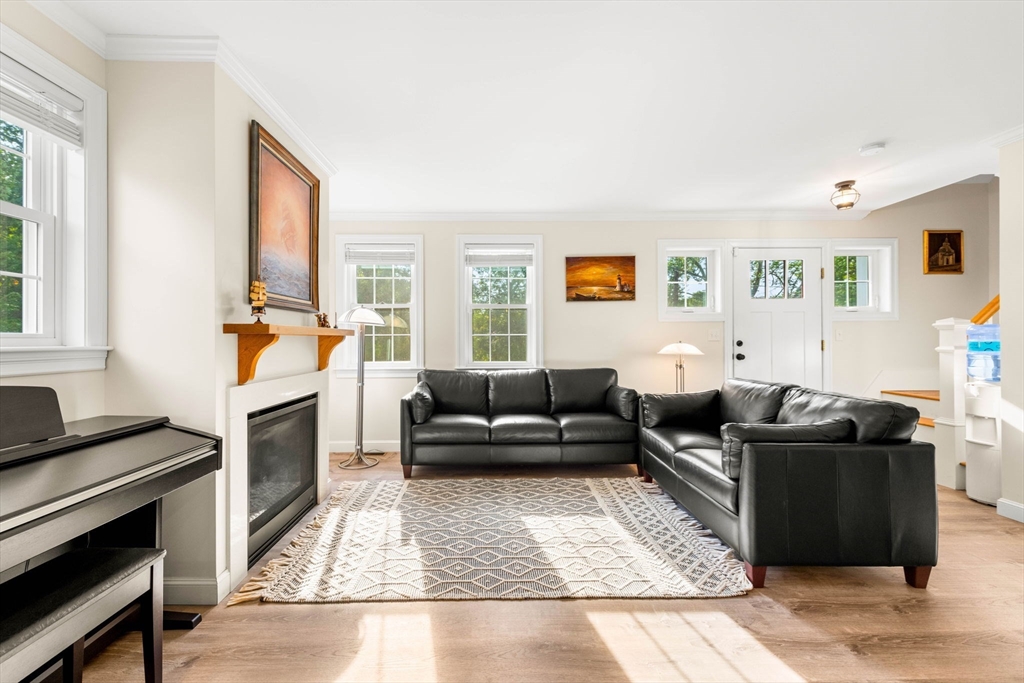 84 Ferry Road Salisbury, MA 01952 - Photo 16 of 42 a living room with furniture and a fireplace