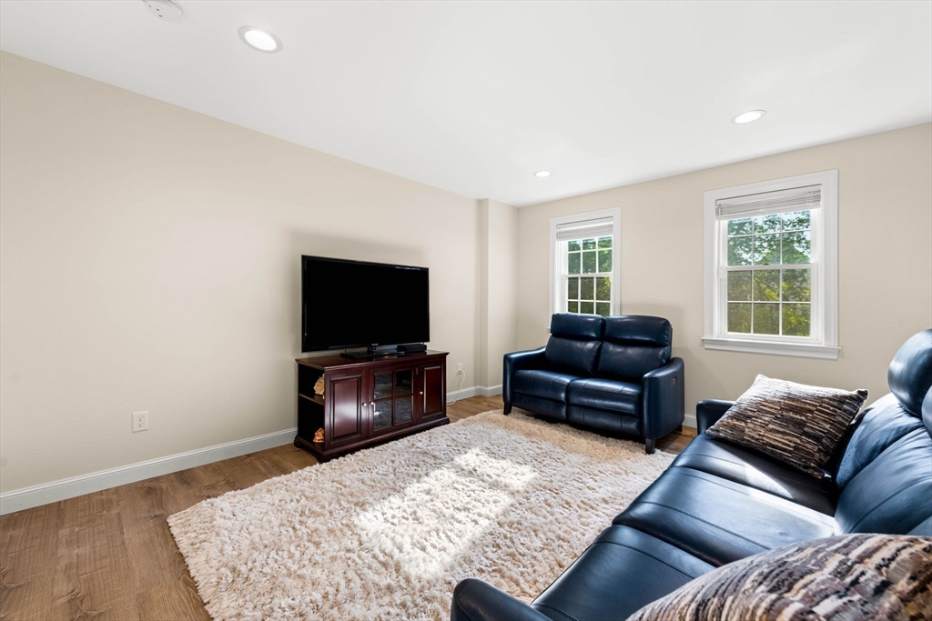 84 Ferry Road Salisbury, MA 01952 - Photo 18 of 42 a living room with furniture and a flat screen tv