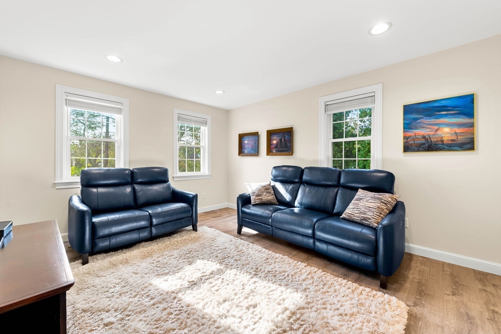 84 Ferry Road Salisbury, MA 01952 - Photo 19 of 42 a living room with furniture and a flat screen tv