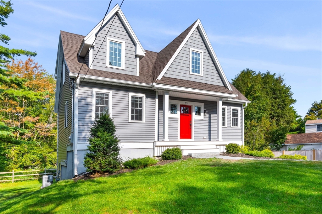 84 Ferry Road Salisbury, MA 01952 - Photo 2 of 42 a front view of a house with a yard and garage