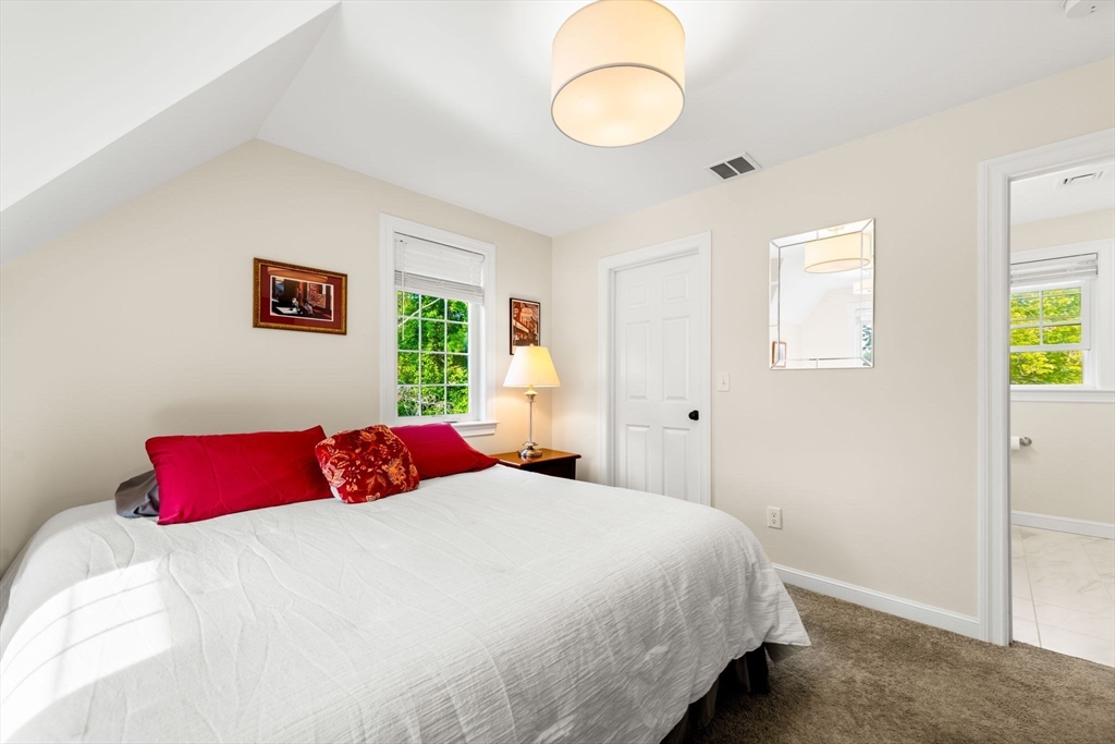 84 Ferry Road Salisbury, MA 01952 - Photo 23 of 42 a bedroom with a bed and a window