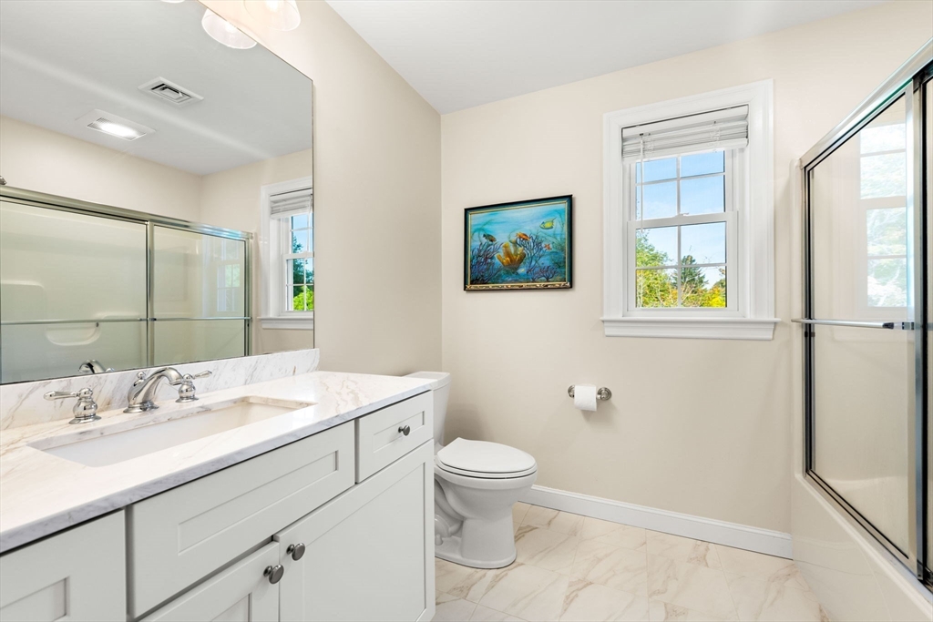 84 Ferry Road Salisbury, MA 01952 - Photo 24 of 42 a bathroom with a sink a toilet and shower