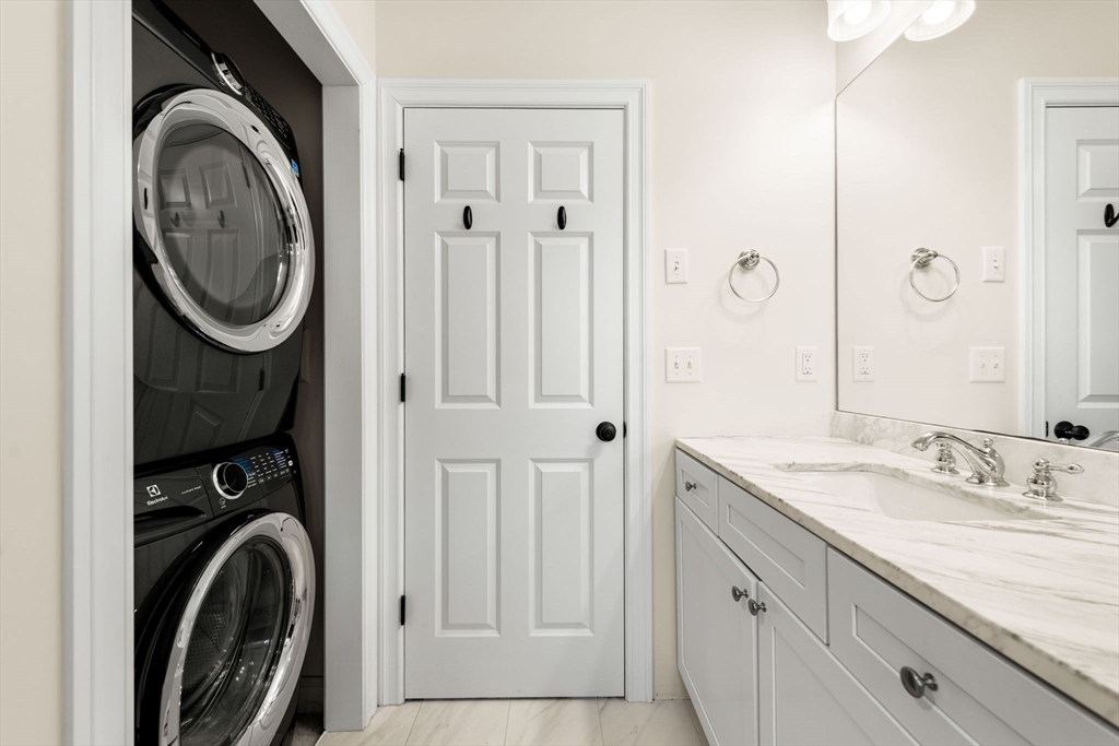 84 Ferry Road Salisbury, MA 01952 - Photo 25 of 42 a bathroom with a sink a washer and dryer