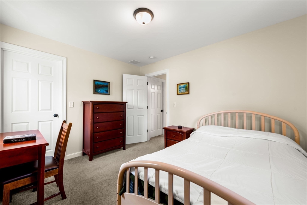84 Ferry Road Salisbury, MA 01952 - Photo 29 of 42 a bedroom with a bed and a desk