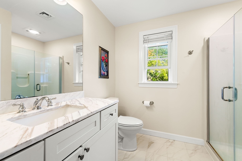 84 Ferry Road Salisbury, MA 01952 - Photo 30 of 42 a bathroom with a granite countertop sink a toilet and shower
