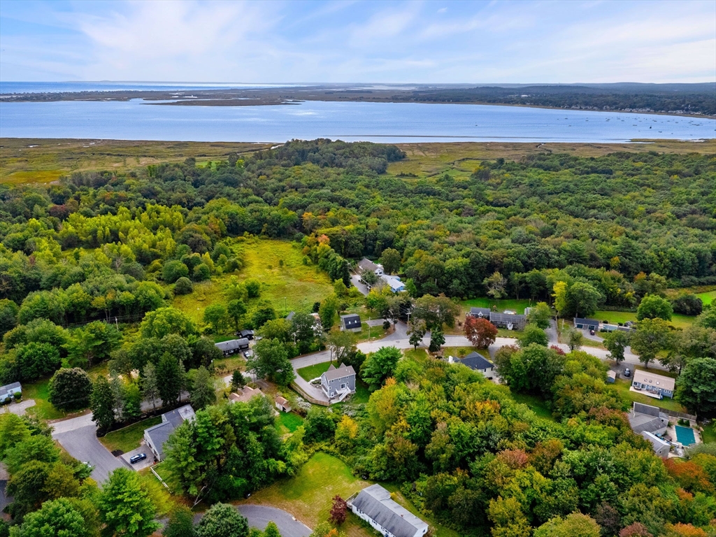 84 Ferry Road Salisbury, MA 01952 - Photo 40 of 42 a view of a large yard with lots of trees