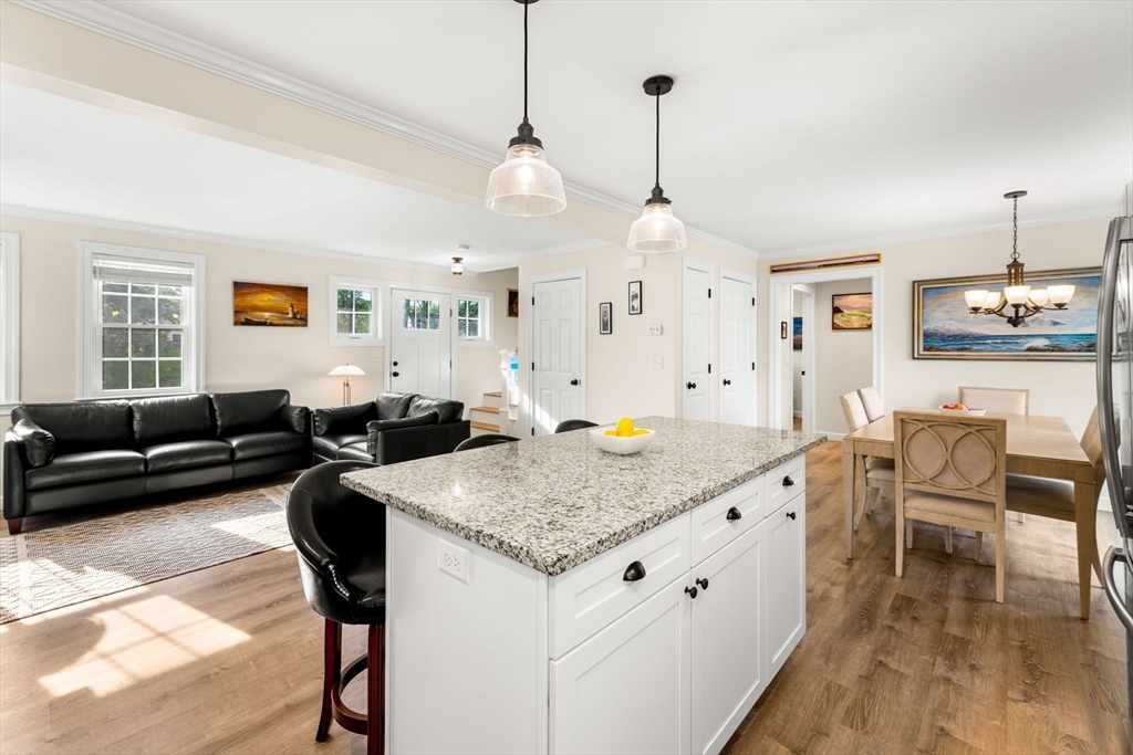 84 Ferry Road Salisbury, MA 01952 - Photo 7 of 42 a living room with stainless steel appliances granite countertop furniture a couch and a view of kitchen