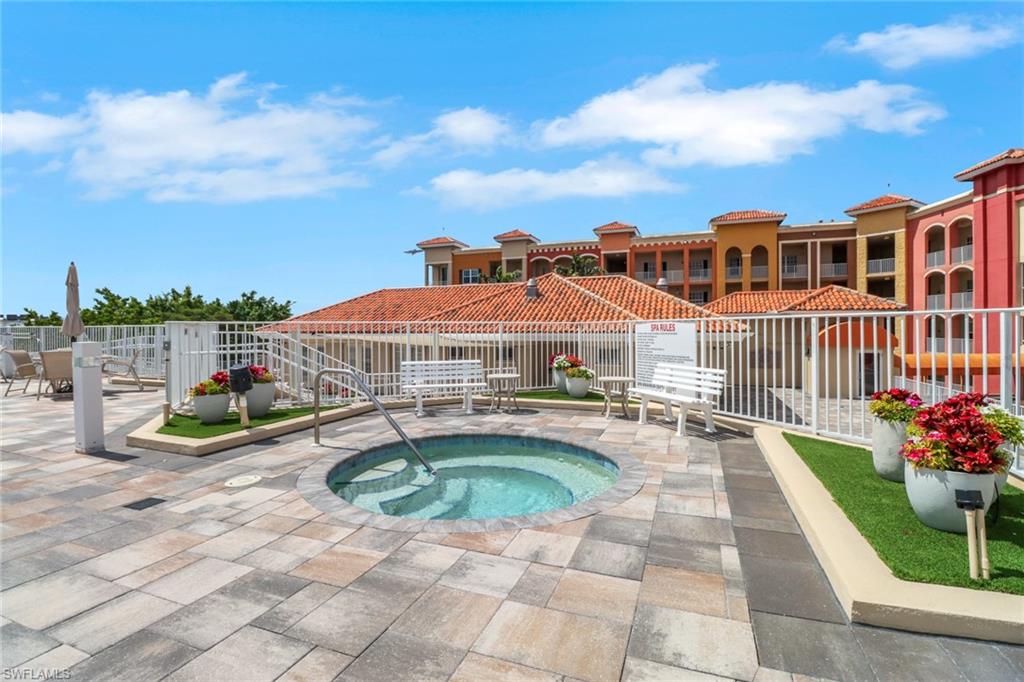 401 Bayfront Place, Unit 3207 Naples, FL 34102 - Photo 17 of 22 View of pool featuring a community hot tub, a pool, and a patio area