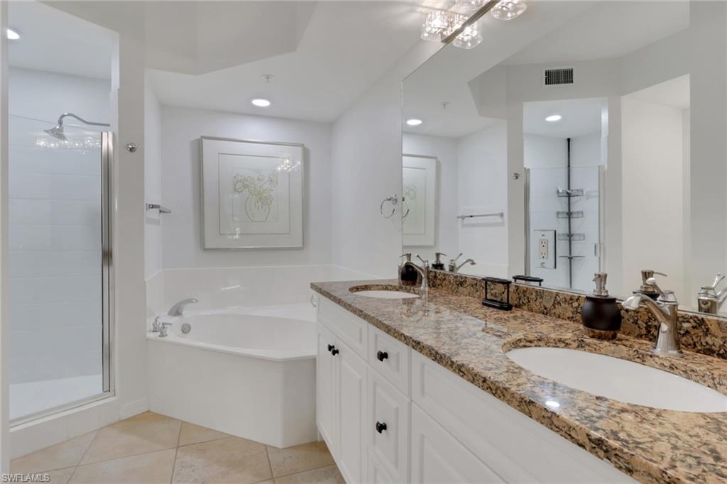 401 Bayfront Place, Unit 3207 Naples, FL 34102 - Photo 5 of 22 Full bath featuring double vanity, light tile patterned flooring, a shower stall, a bath, and recessed lighting