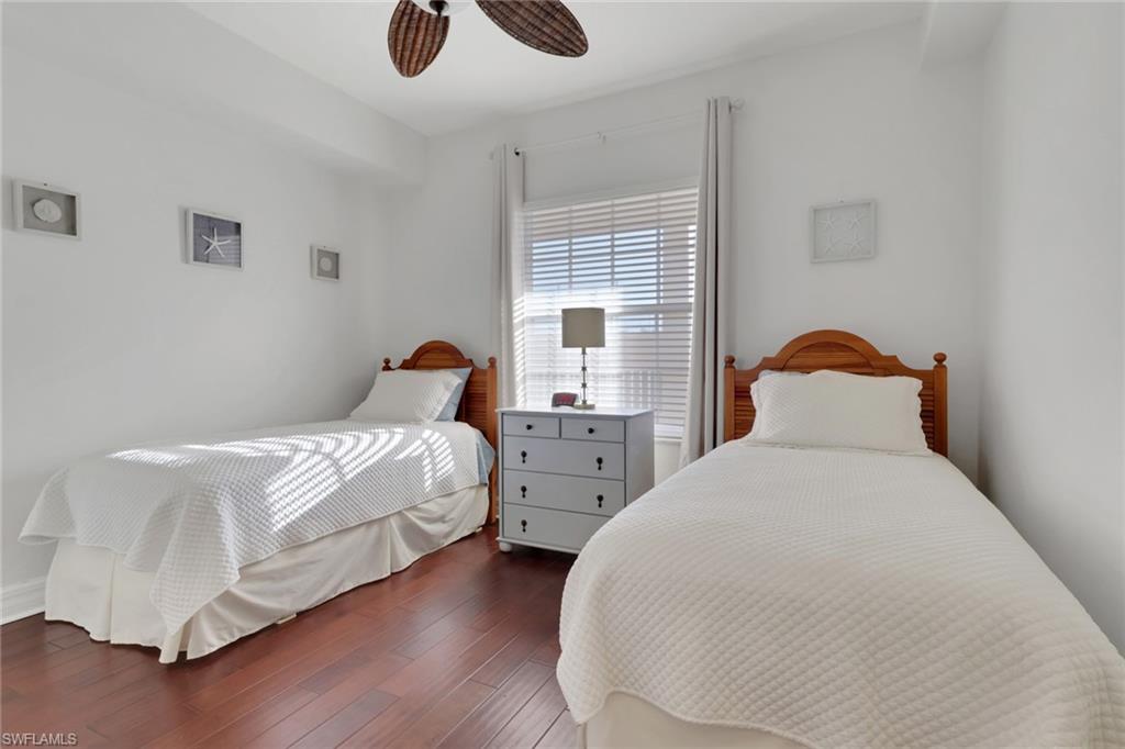 401 Bayfront Place, Unit 3207 Naples, FL 34102 - Photo 6 of 22 Bedroom featuring wood finished floors and a ceiling fan