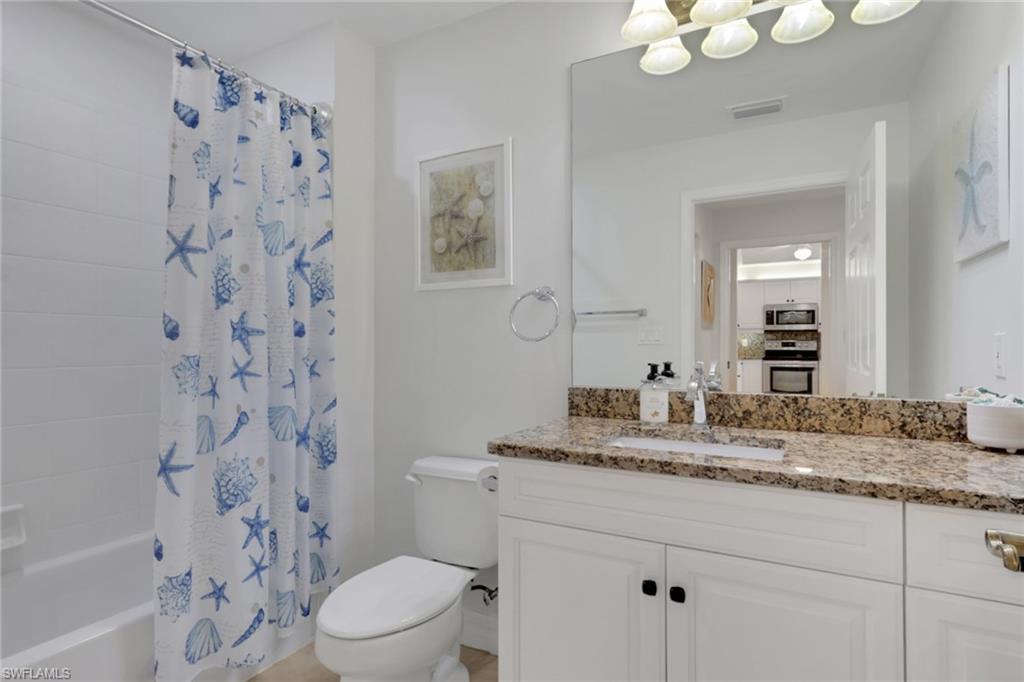401 Bayfront Place, Unit 3207 Naples, FL 34102 - Photo 7 of 22 Bathroom featuring vanity and shower / tub combo with curtain