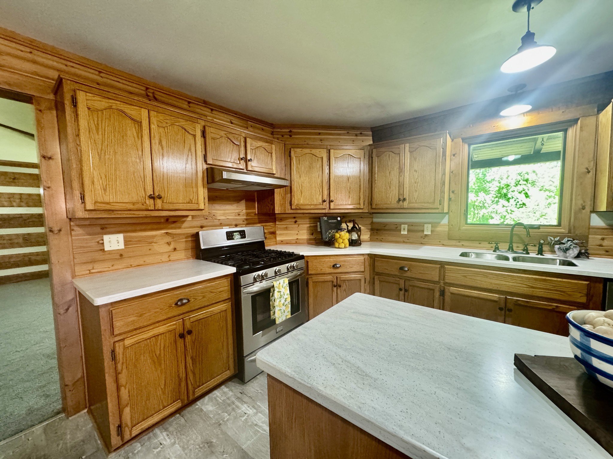1342 Aetna Church Road Centerville, TN 37033 - Photo 42 of 59 a kitchen with a sink stove top oven and refrigerator