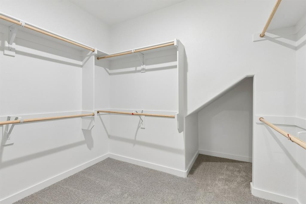 2303 Wind River Road Princeton, TX 75407 - Photo 17 of 32 Primary Closet in the Winters home plan by Trophy Signature Homes – REPRESENTATIVE PHOTO